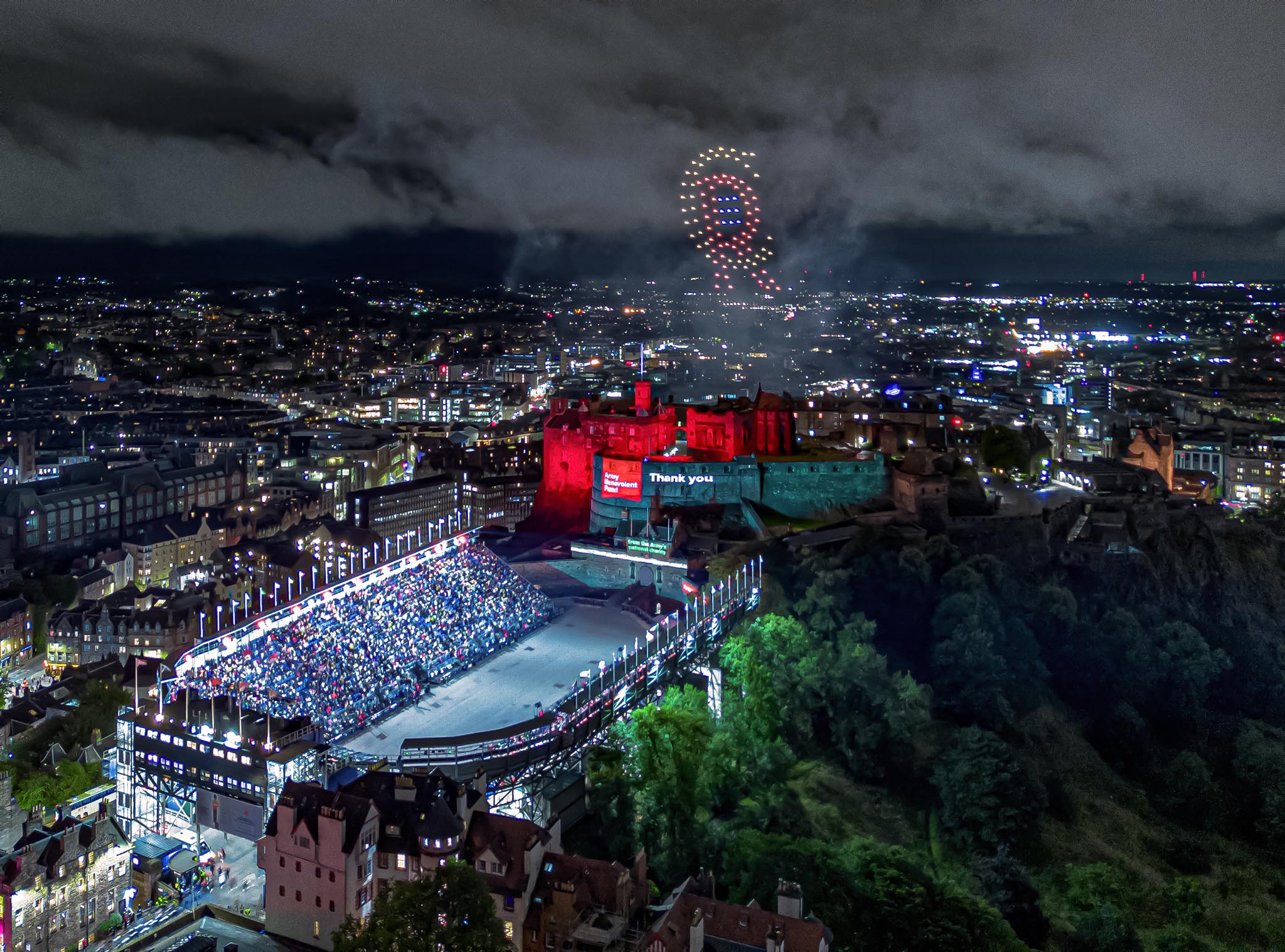100 drones flying over Edinburgh Castle for The Royal Edinburgh Military Tattoo forming King Charles' royal crest
